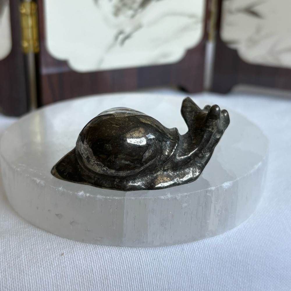 Pyrite crystal snail carving